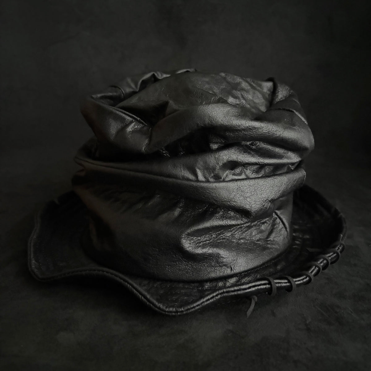 Dense black leather turn bucket hat