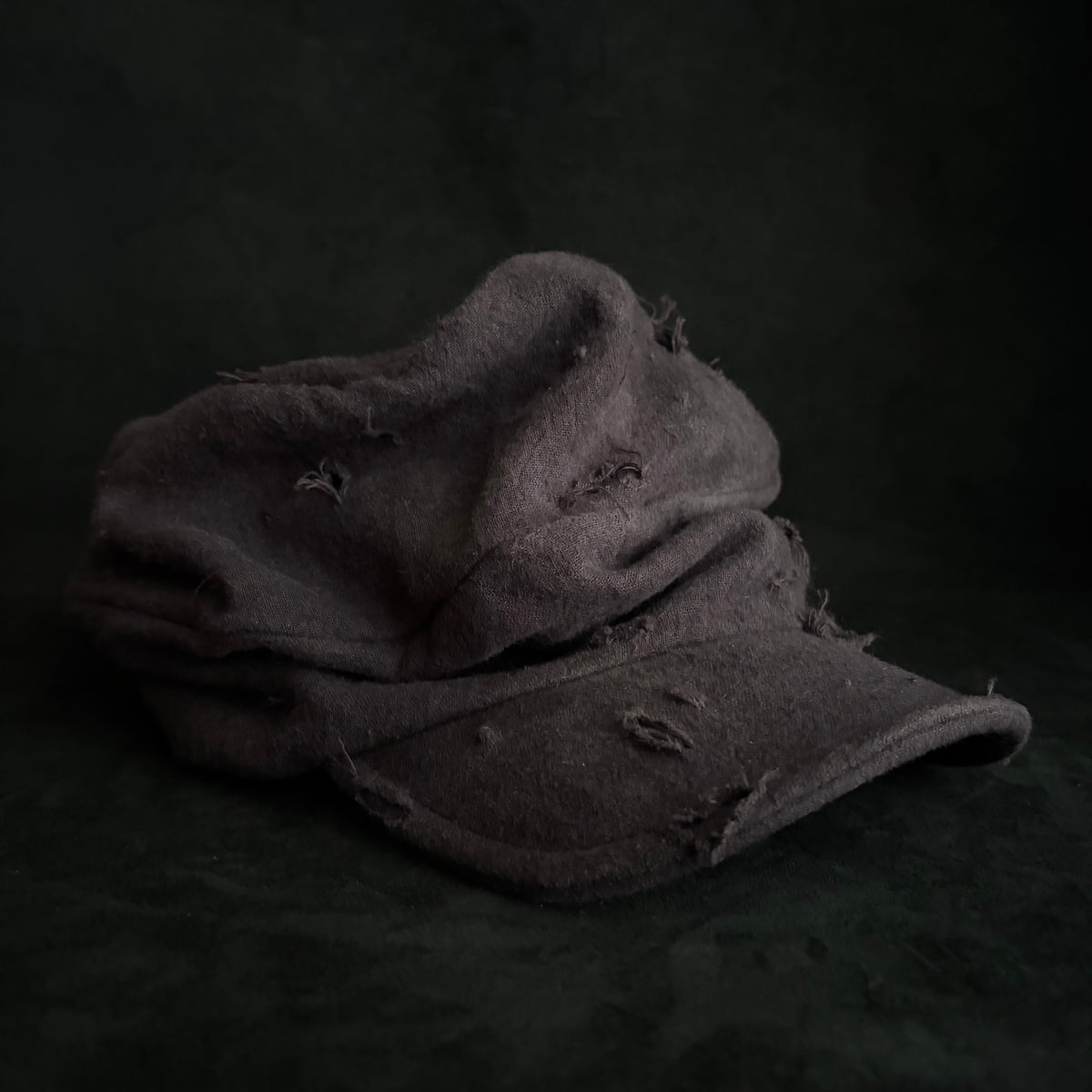 Formerly damage brown linen turn cap