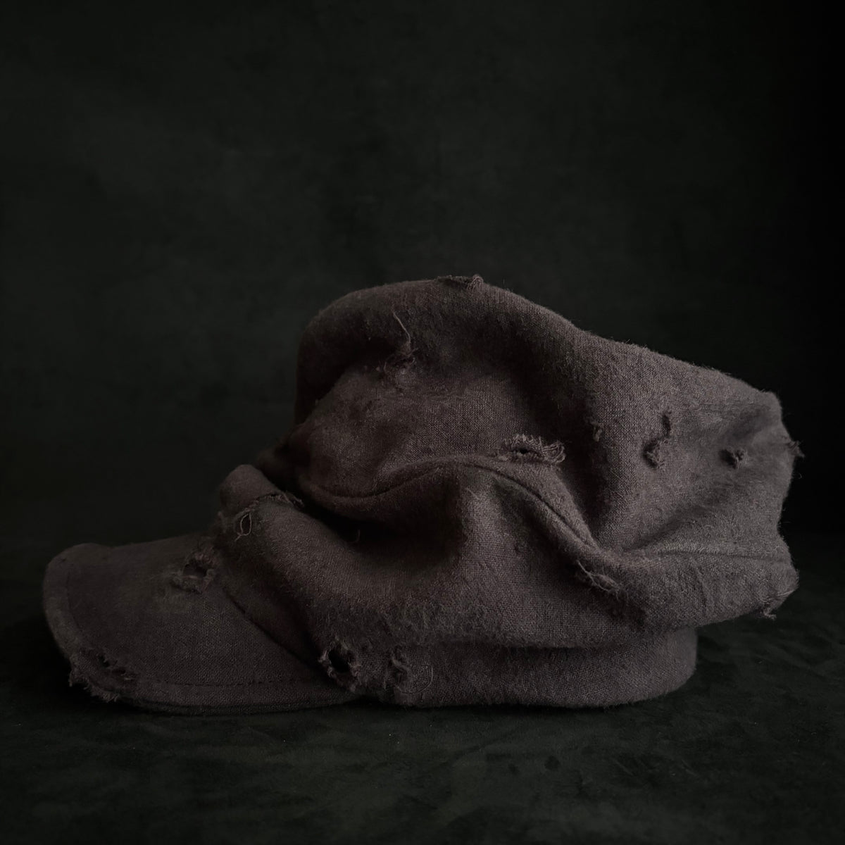 Formerly damage brown linen turn cap