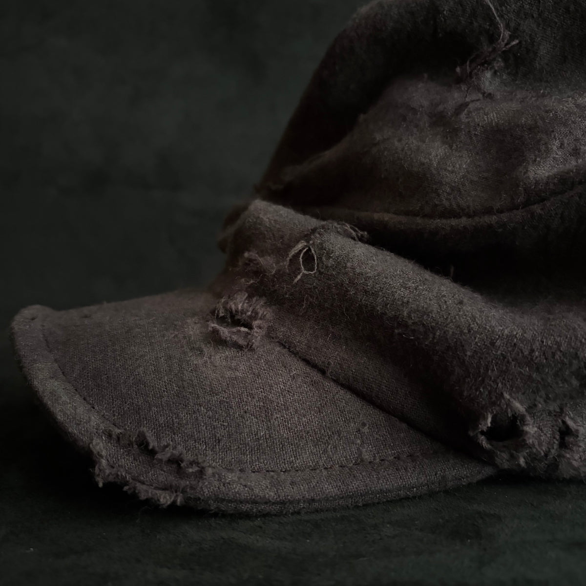 Formerly damage brown linen turn cap