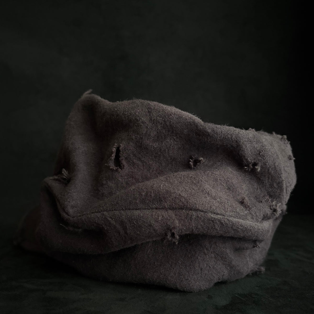 Formerly damage brown linen turn cap
