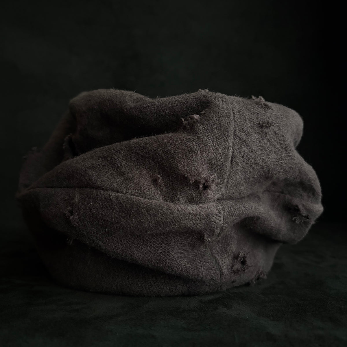 Formerly damage brown linen turn cap