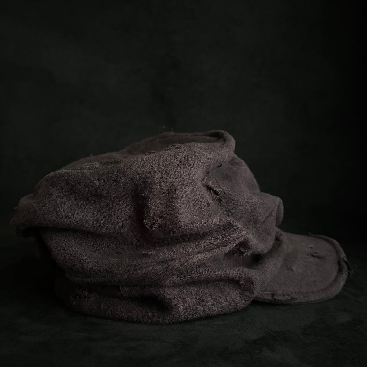 Formerly damage brown linen turn cap
