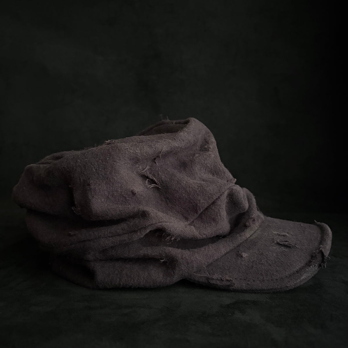 Formerly damage brown linen turn cap