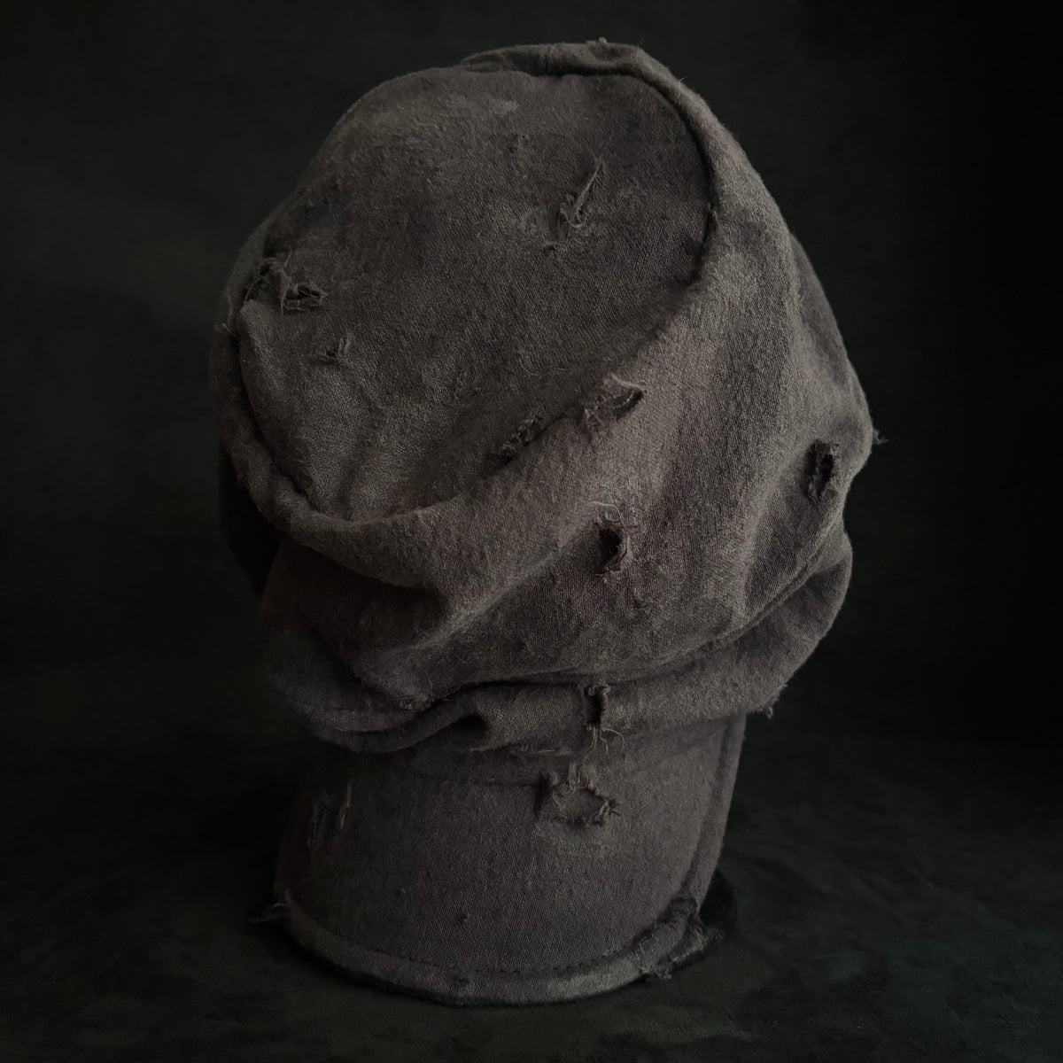 Formerly damage brown linen turn cap