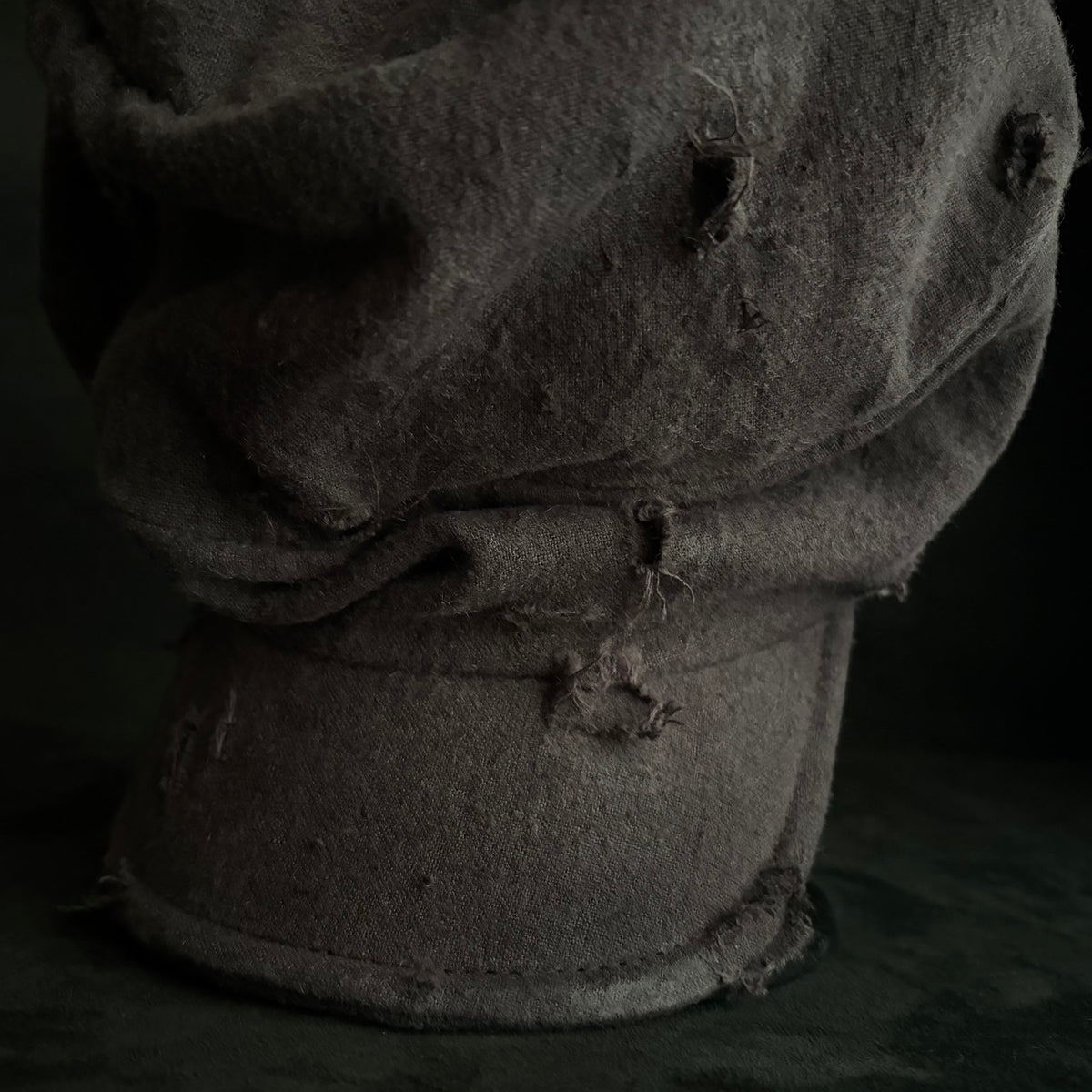 Formerly damage brown linen turn cap