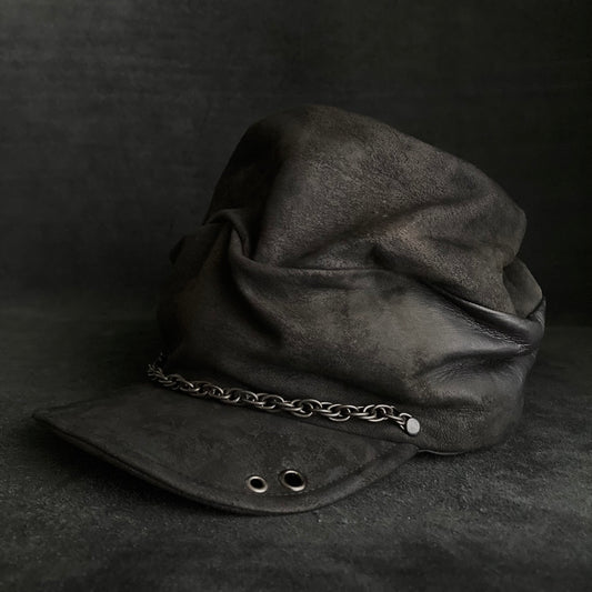 Rubbed black leather chain turn cap