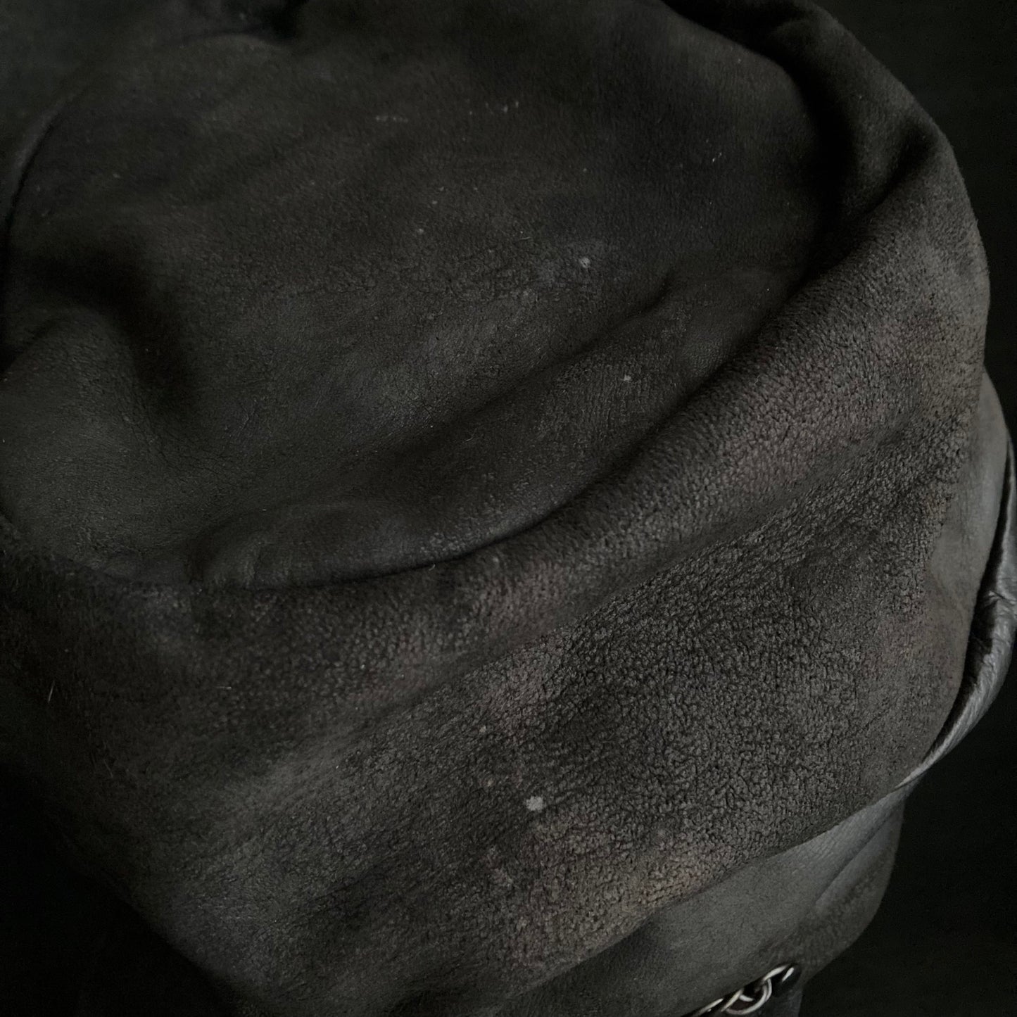 Rubbed black leather chain turn cap