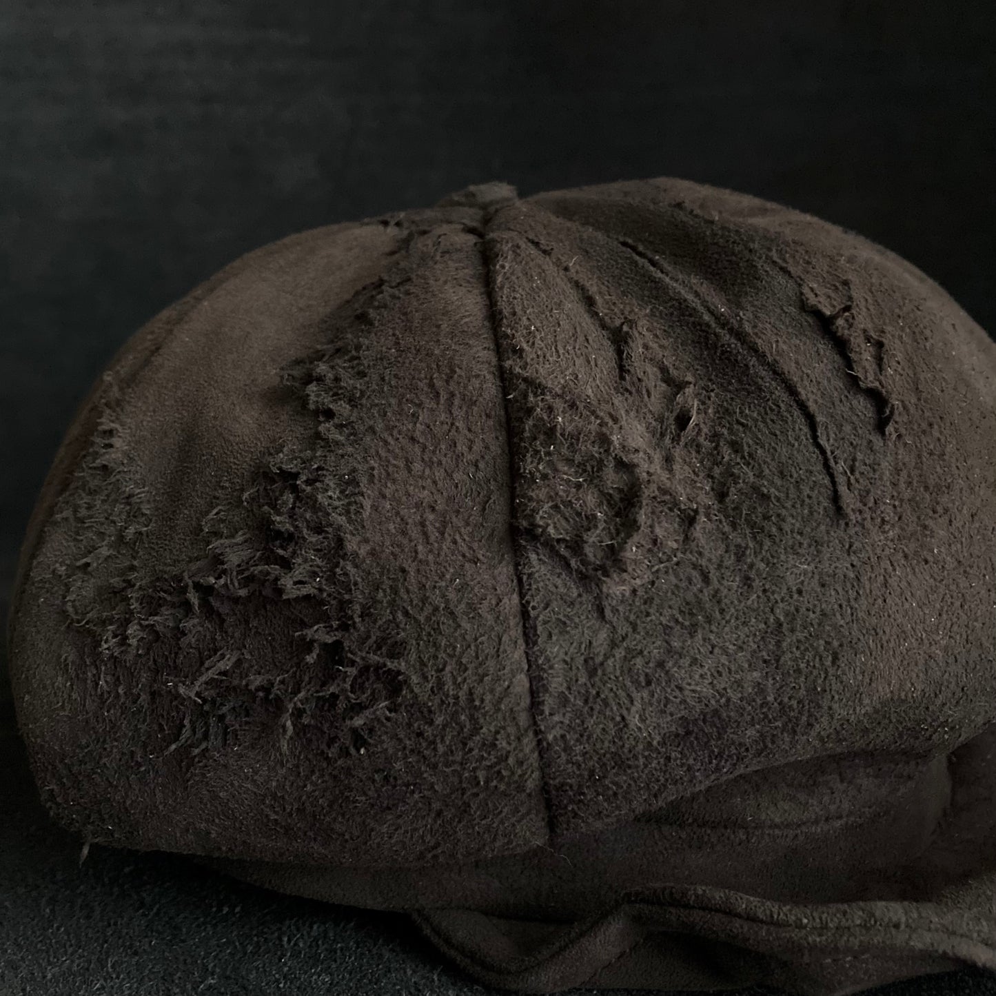 Worn out dark brown leather casquette