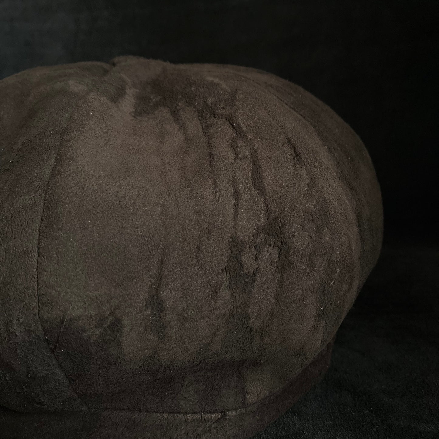 Worn out dark brown leather casquette