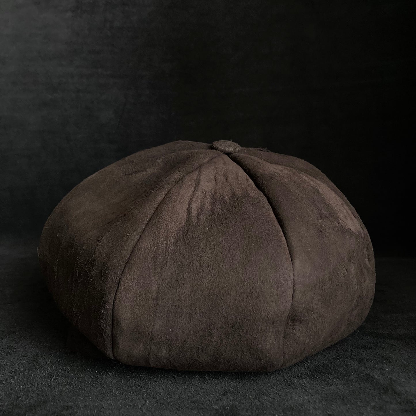 Worn out dark brown leather casquette