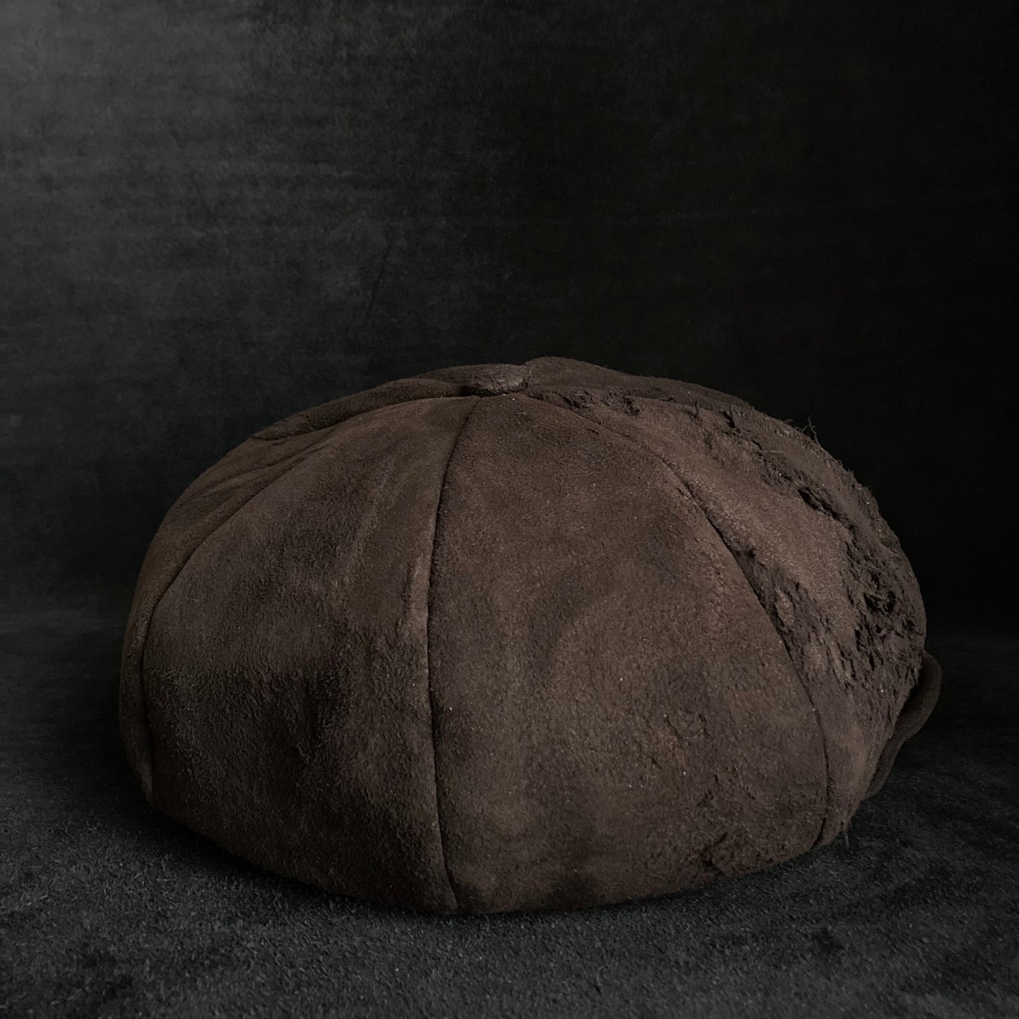 Worn out dark brown leather casquette