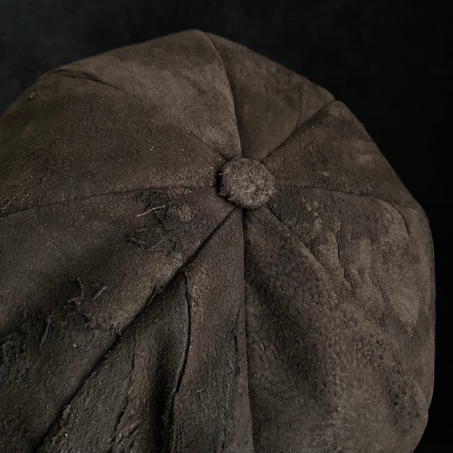 Worn out dark brown leather casquette