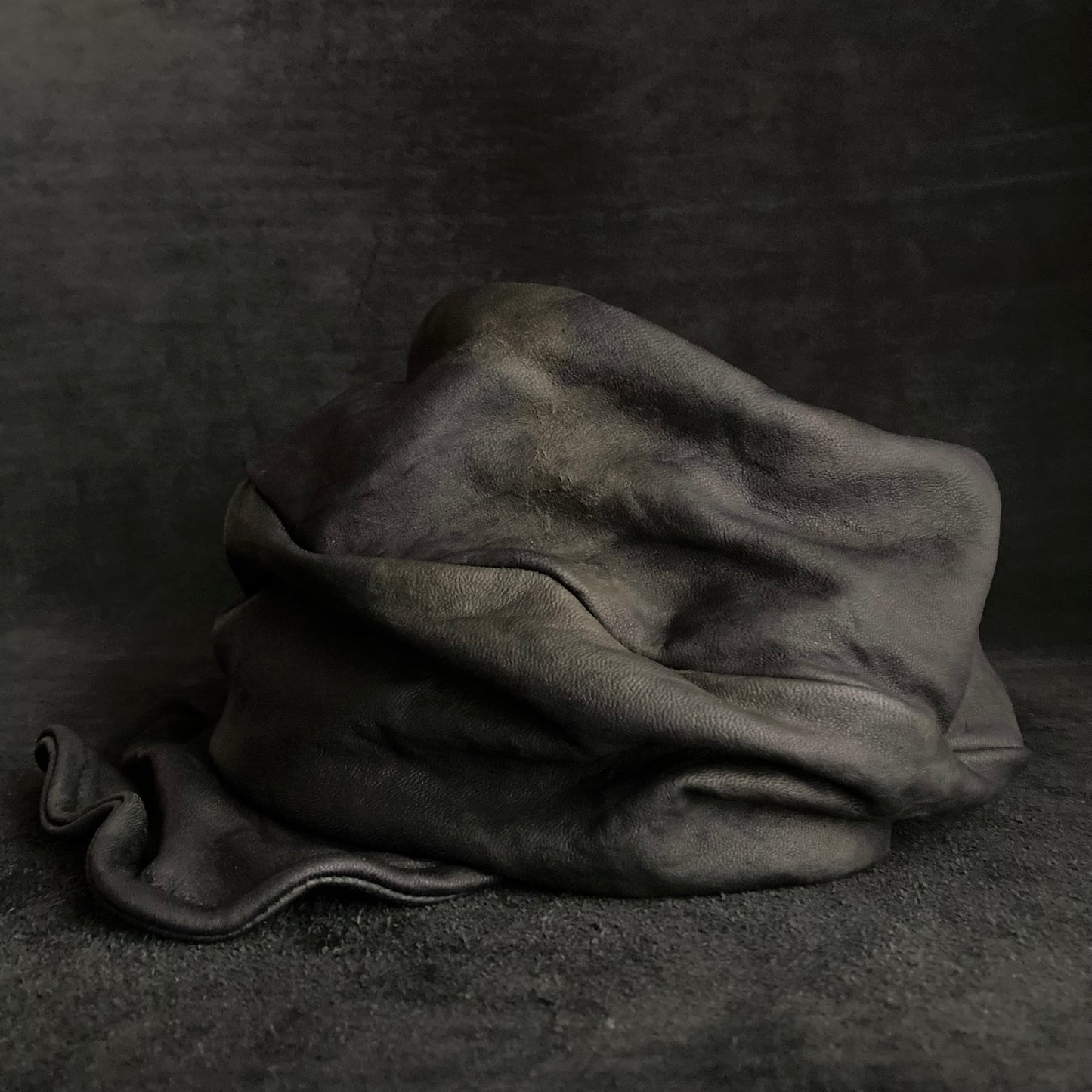 Old black leather turn cap