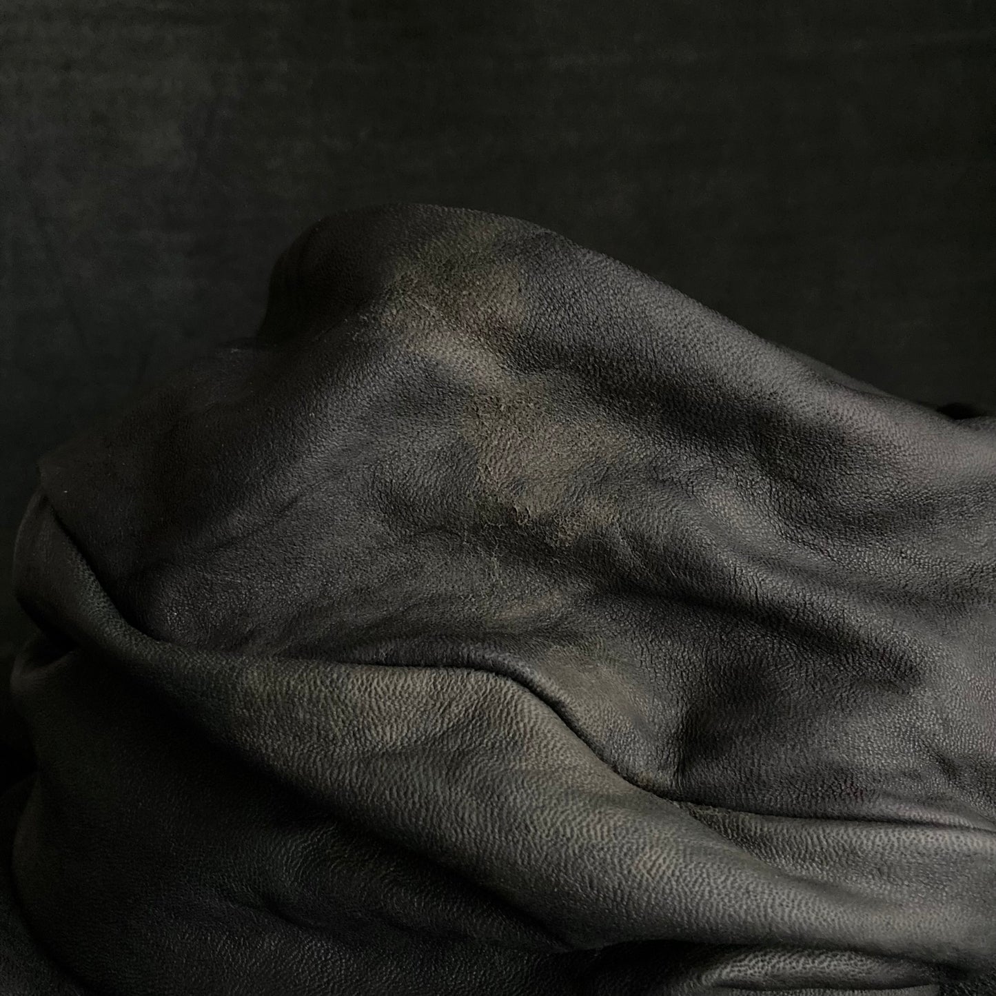 Old black leather turn cap