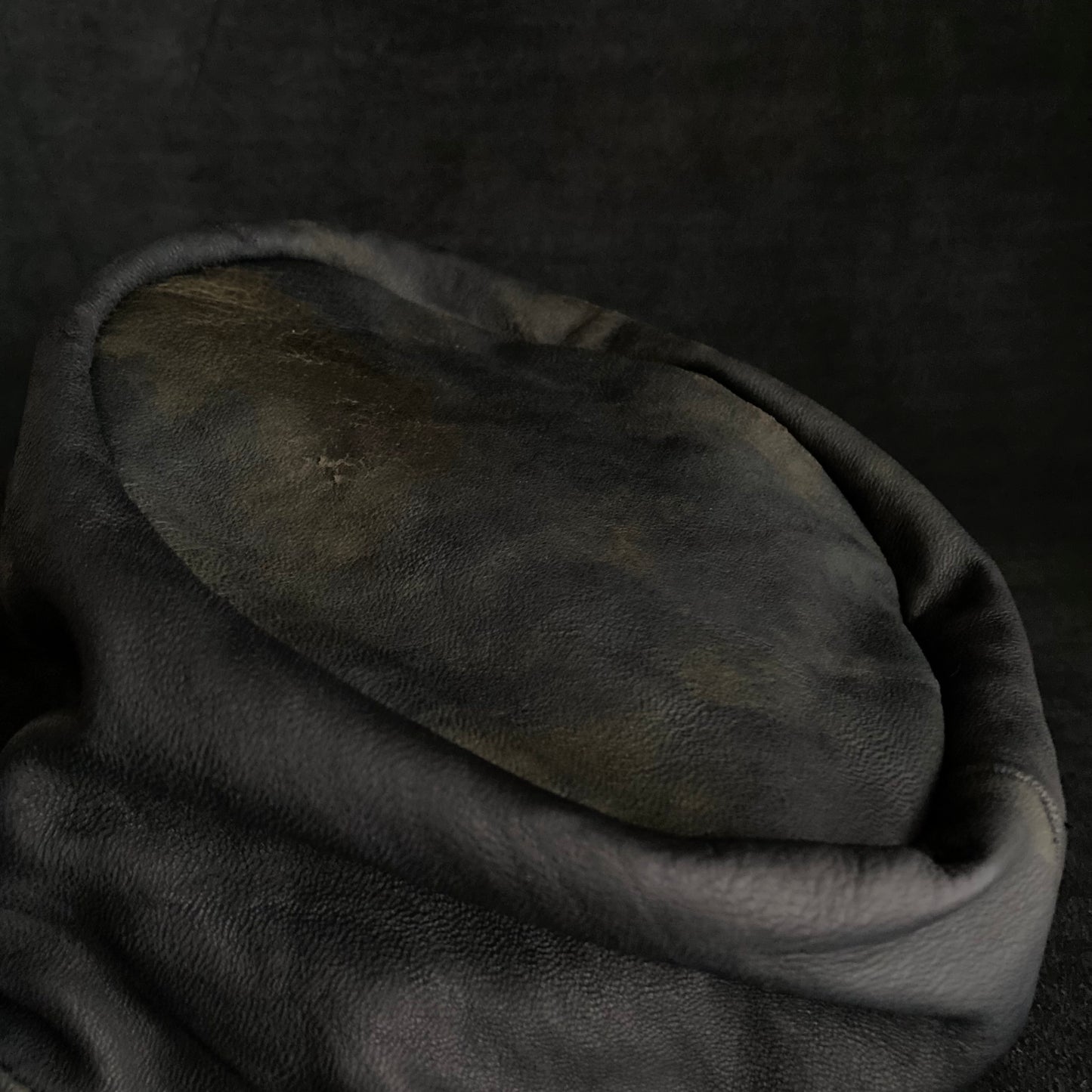 Old black leather turn cap