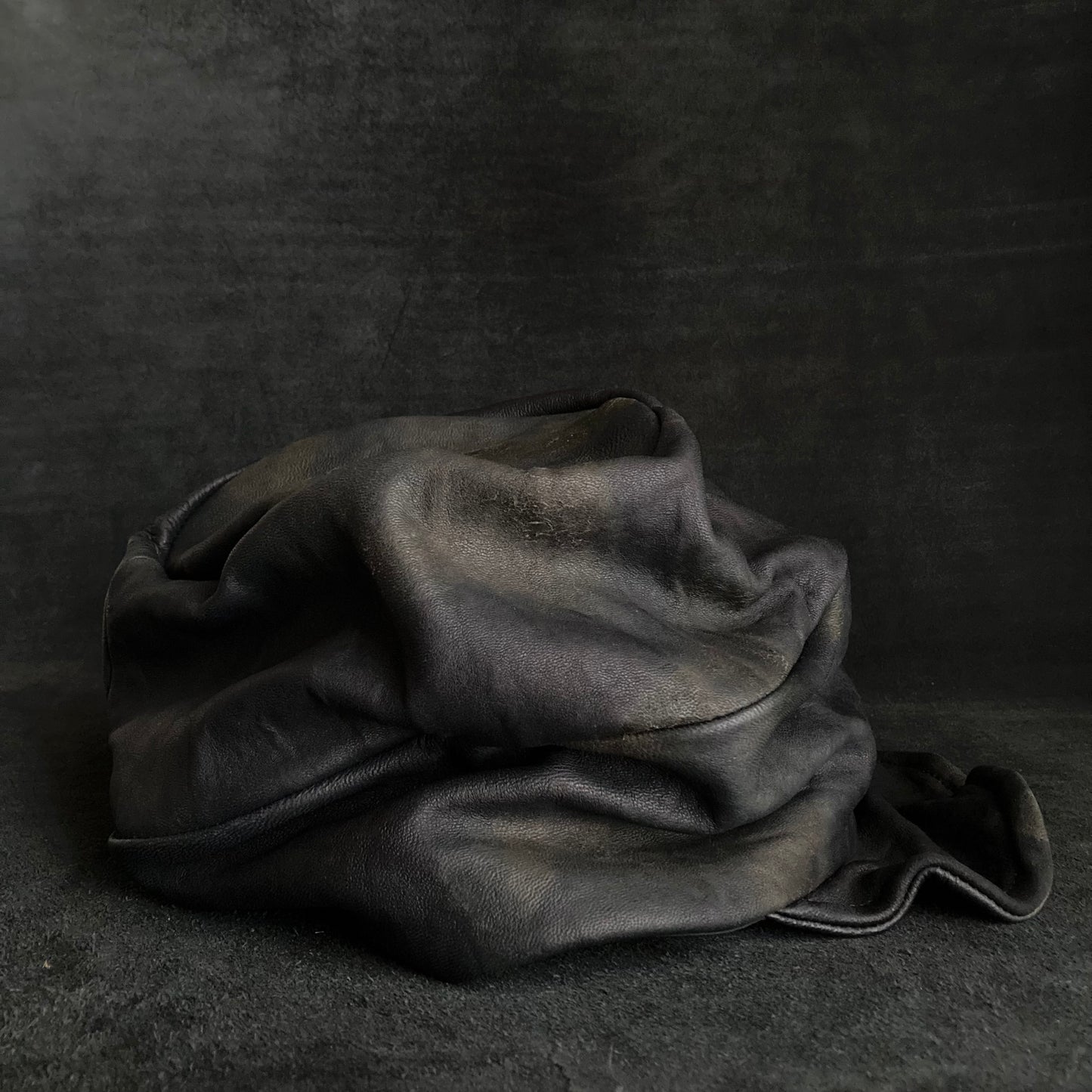 Old black leather turn cap