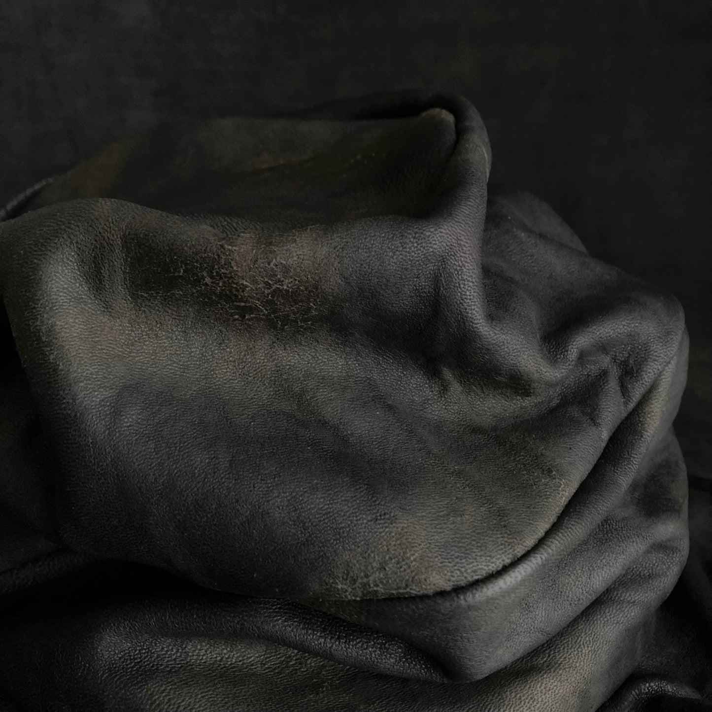 Old black leather turn cap