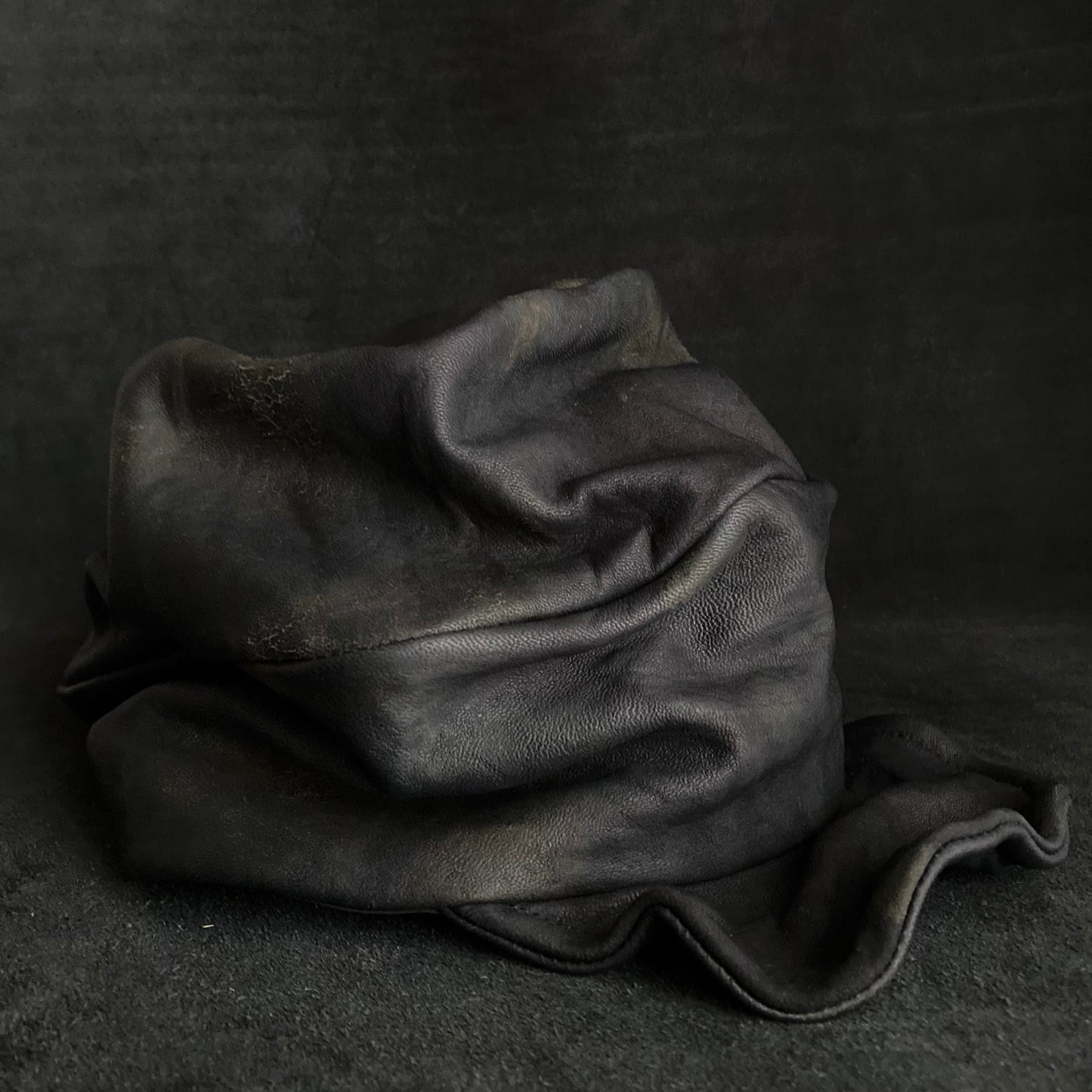 Old black leather turn cap