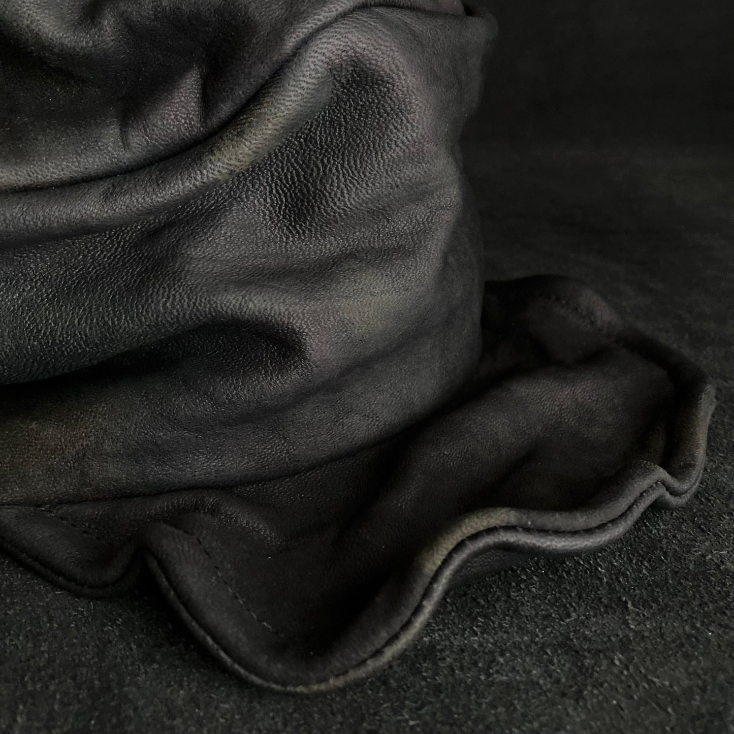 Old black leather turn cap