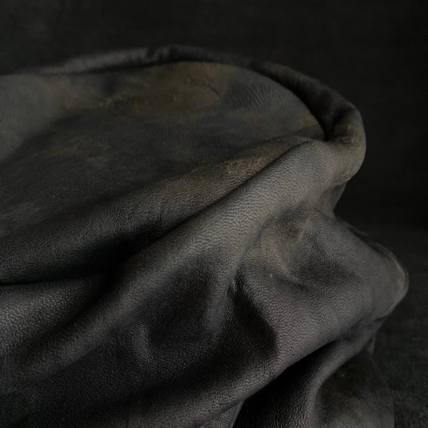 Old black leather turn cap