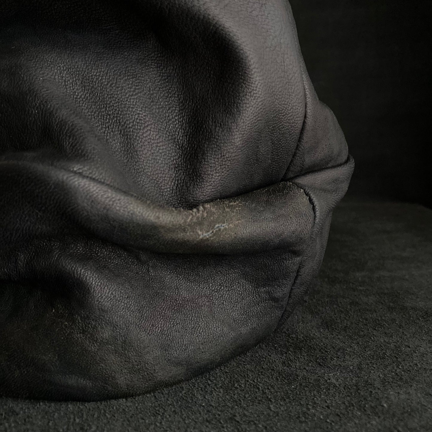 Old black leather turn cap