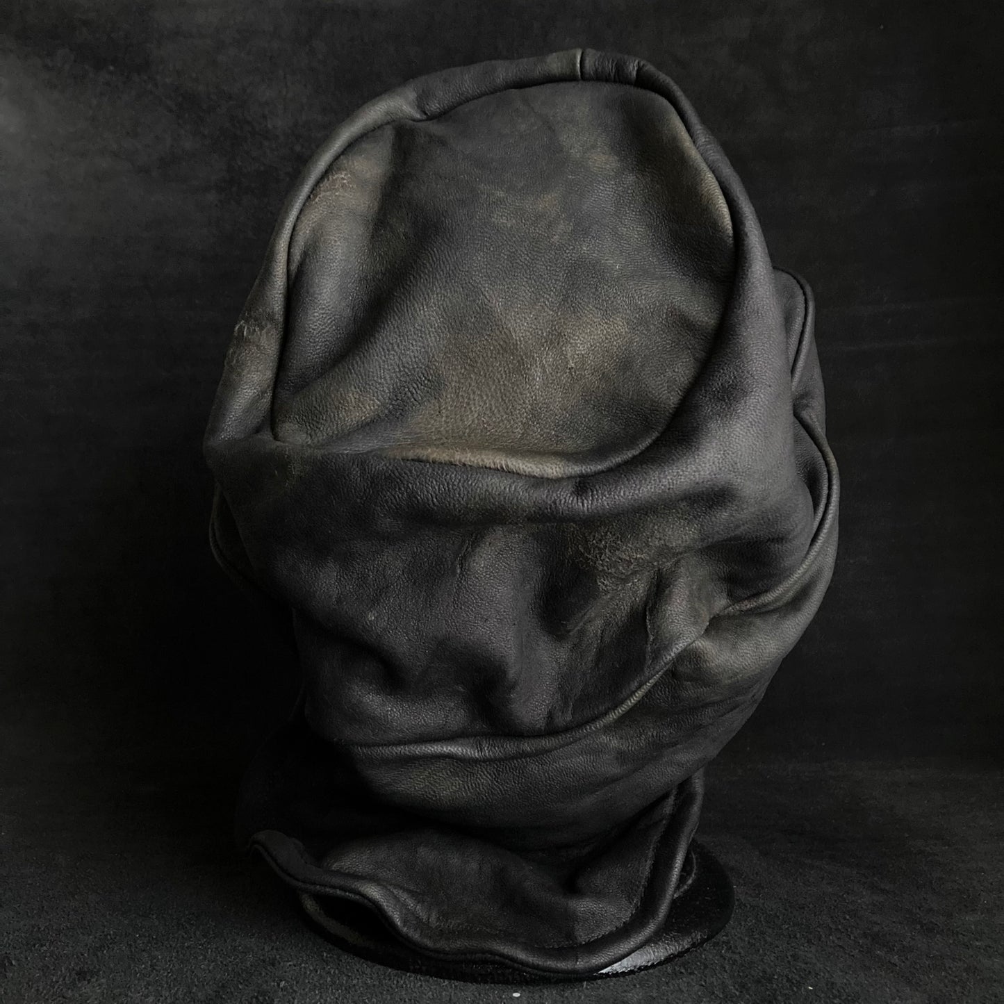 Old black leather turn cap