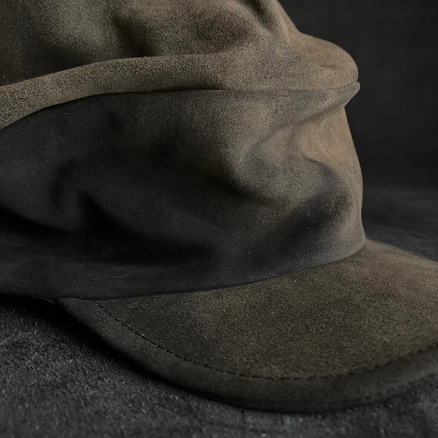 Discolored blurry leather turn cap