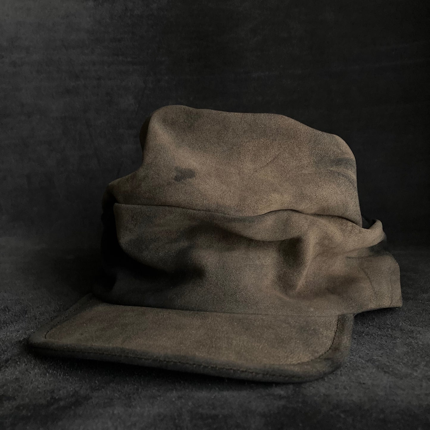 Discolored blurry leather turn cap