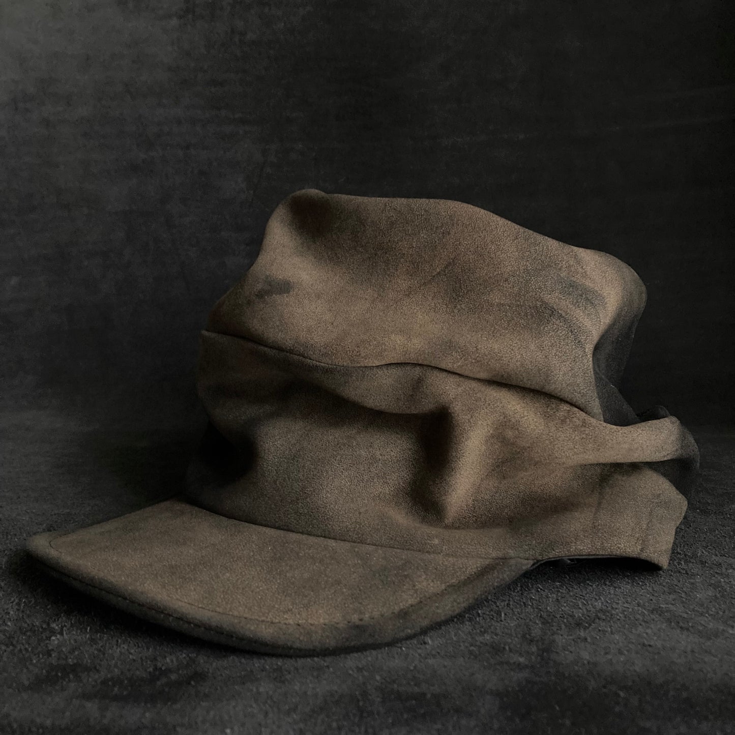 Discolored blurry leather turn cap