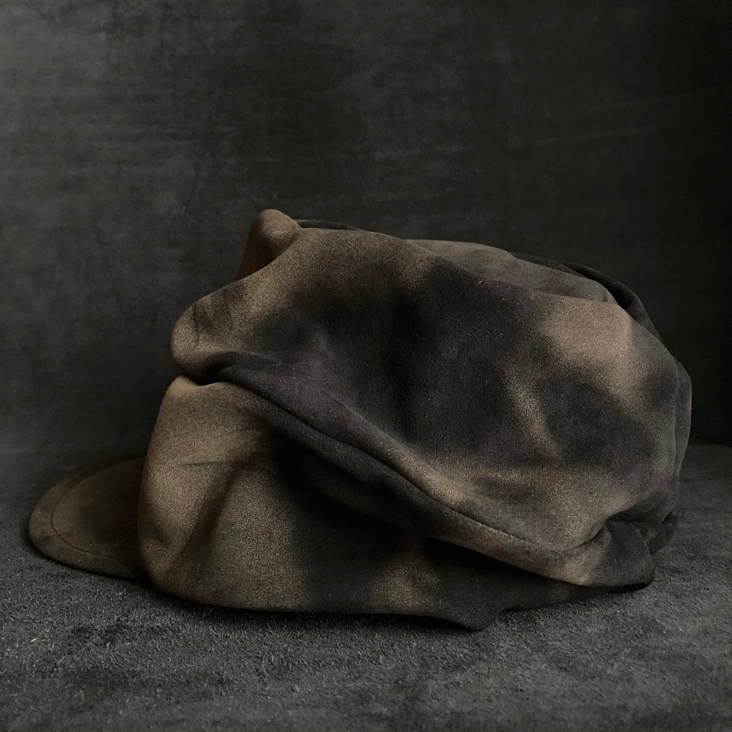 Discolored blurry leather turn cap