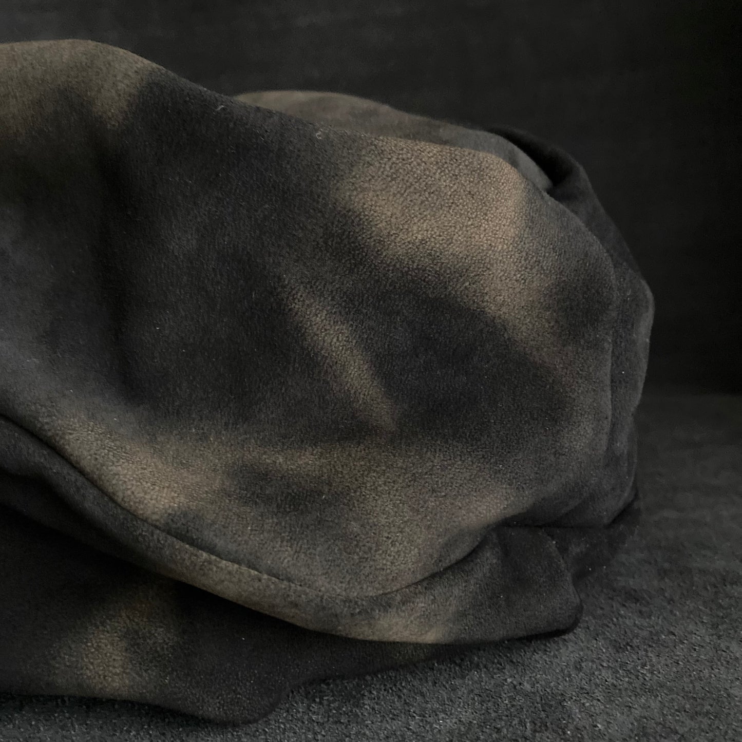 Discolored blurry leather turn cap