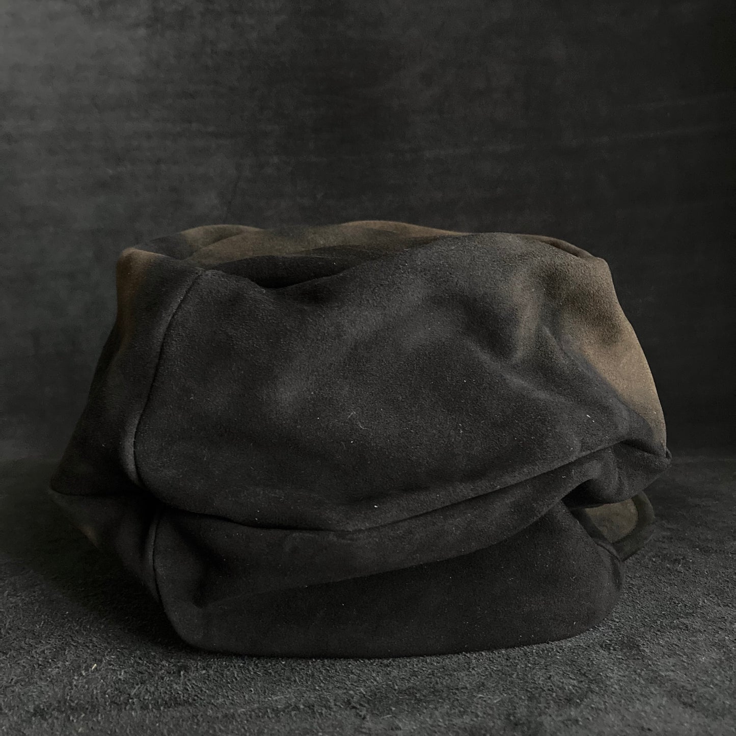 Discolored blurry leather turn cap