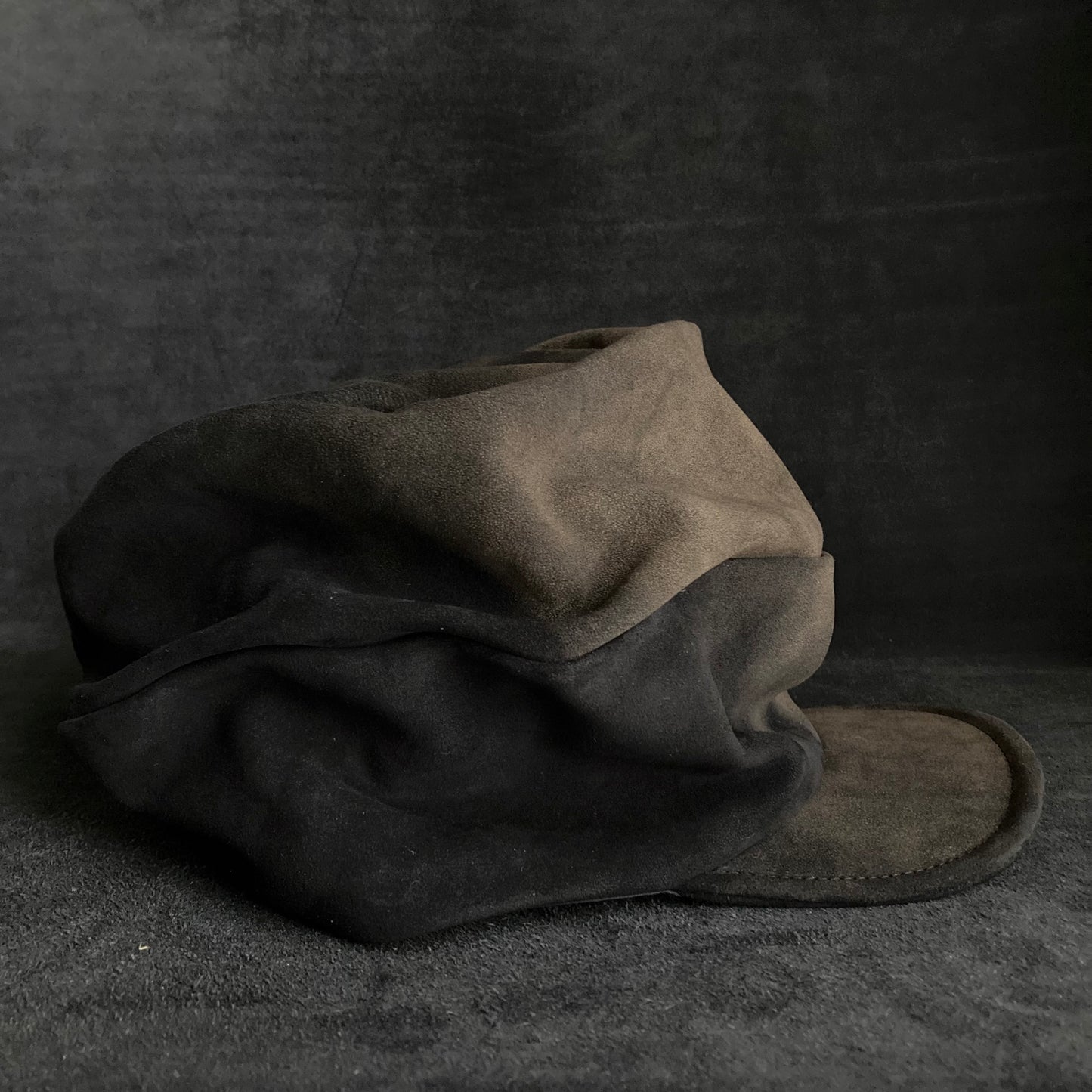 Discolored blurry leather turn cap