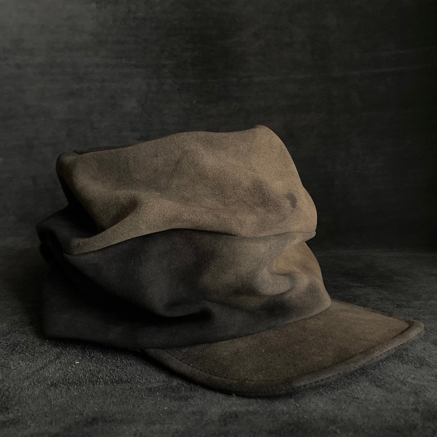 Discolored blurry leather turn cap