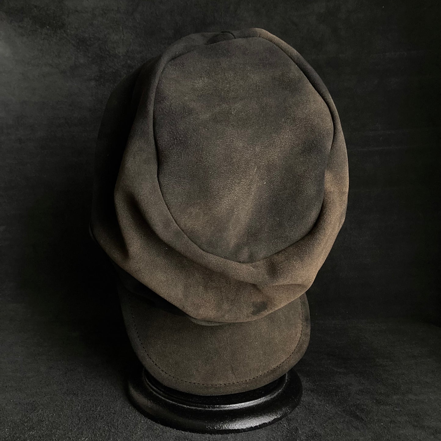 Discolored blurry leather turn cap