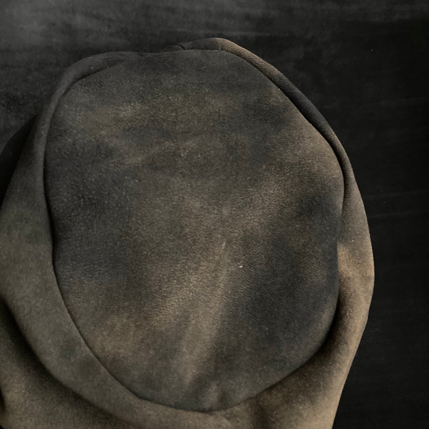 Discolored blurry leather turn cap