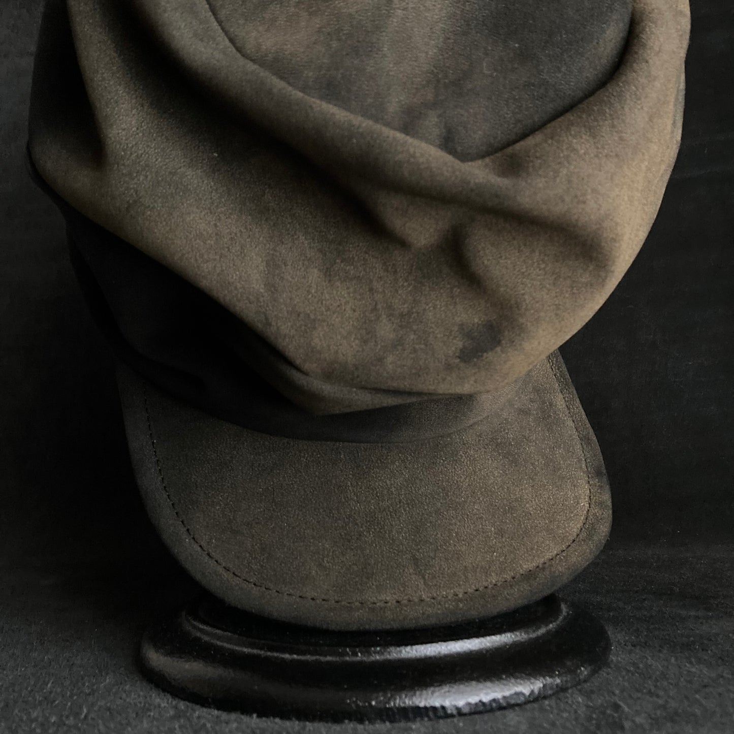 Discolored blurry leather turn cap