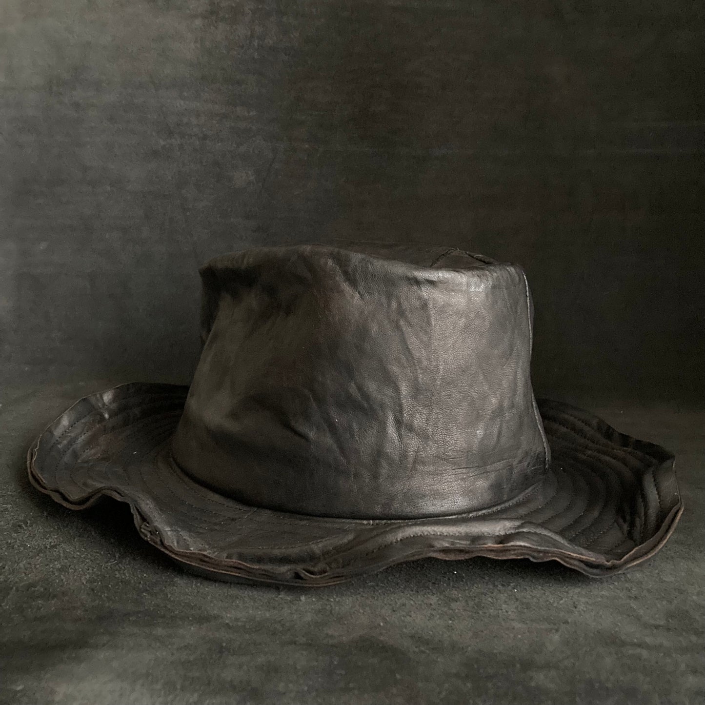 Cracked black leather fedora hat