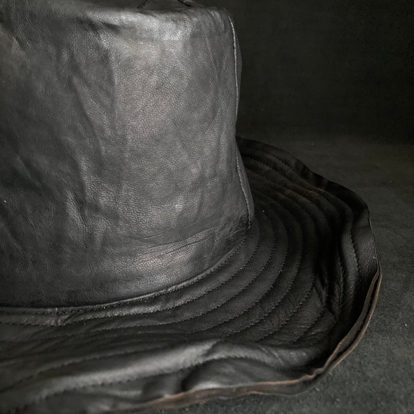 Cracked black leather fedora hat