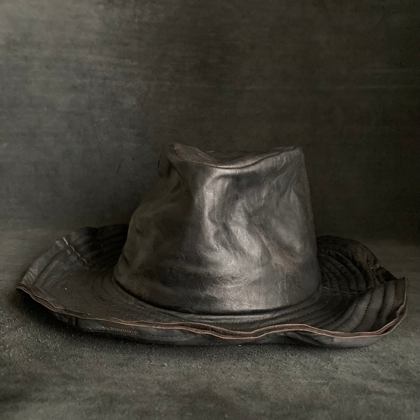 Cracked black leather fedora hat