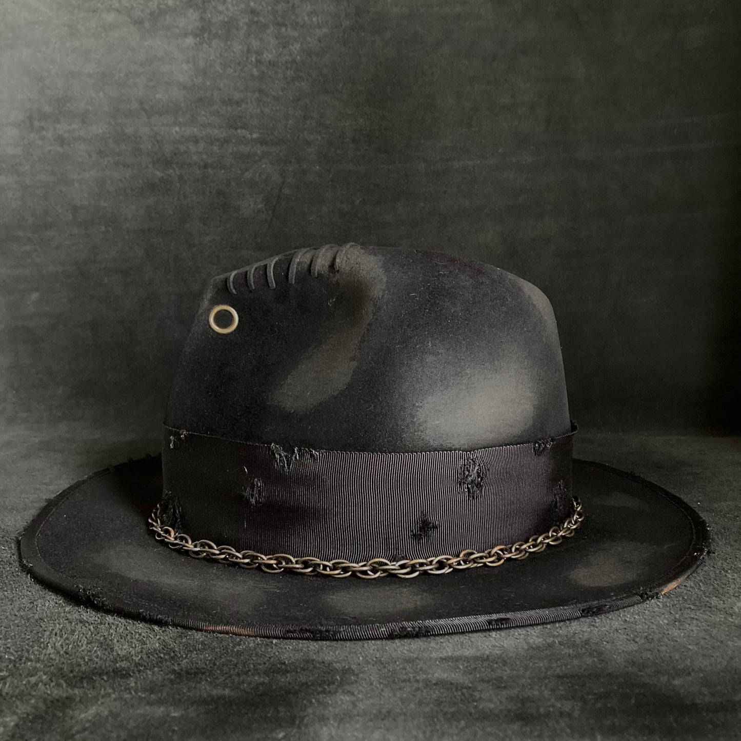 Eyelet burned hi-fedora hat