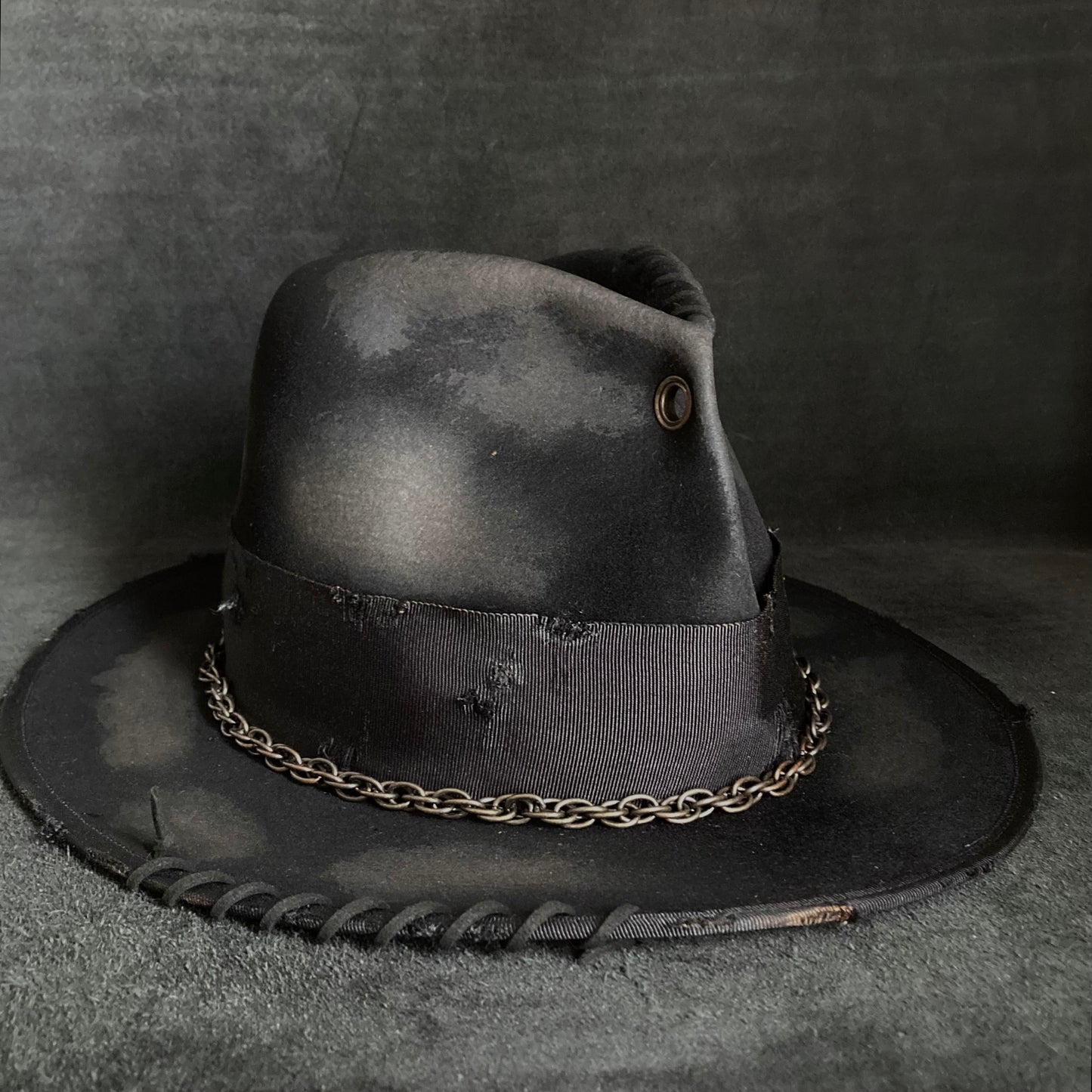 Eyelet burned hi-fedora hat