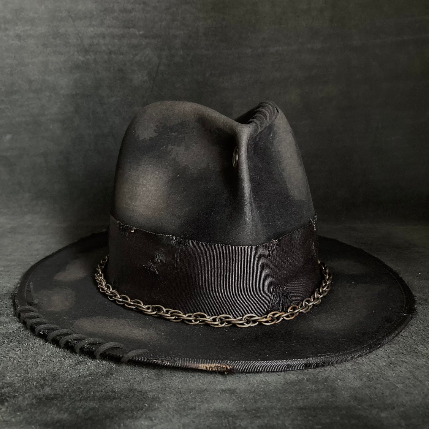 Eyelet burned hi-fedora hat