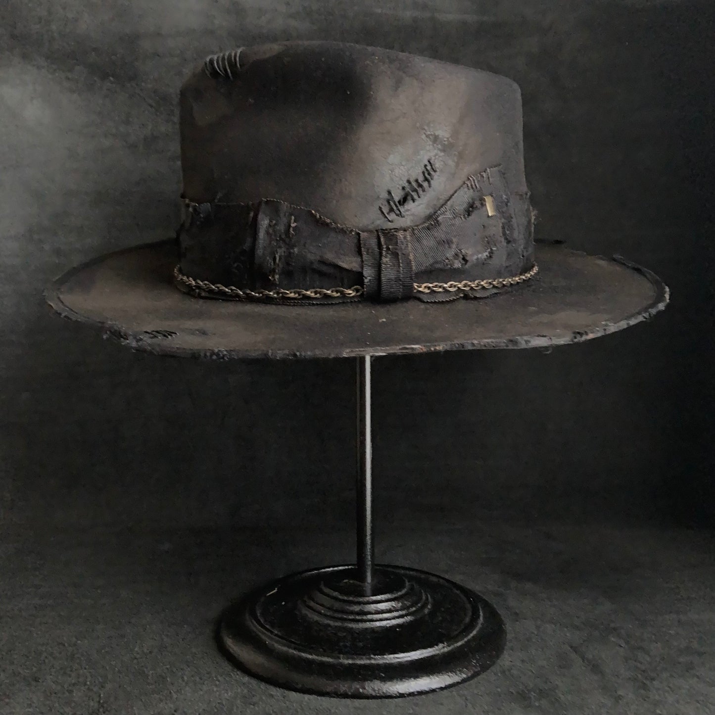 Damaged black rabbit fedora