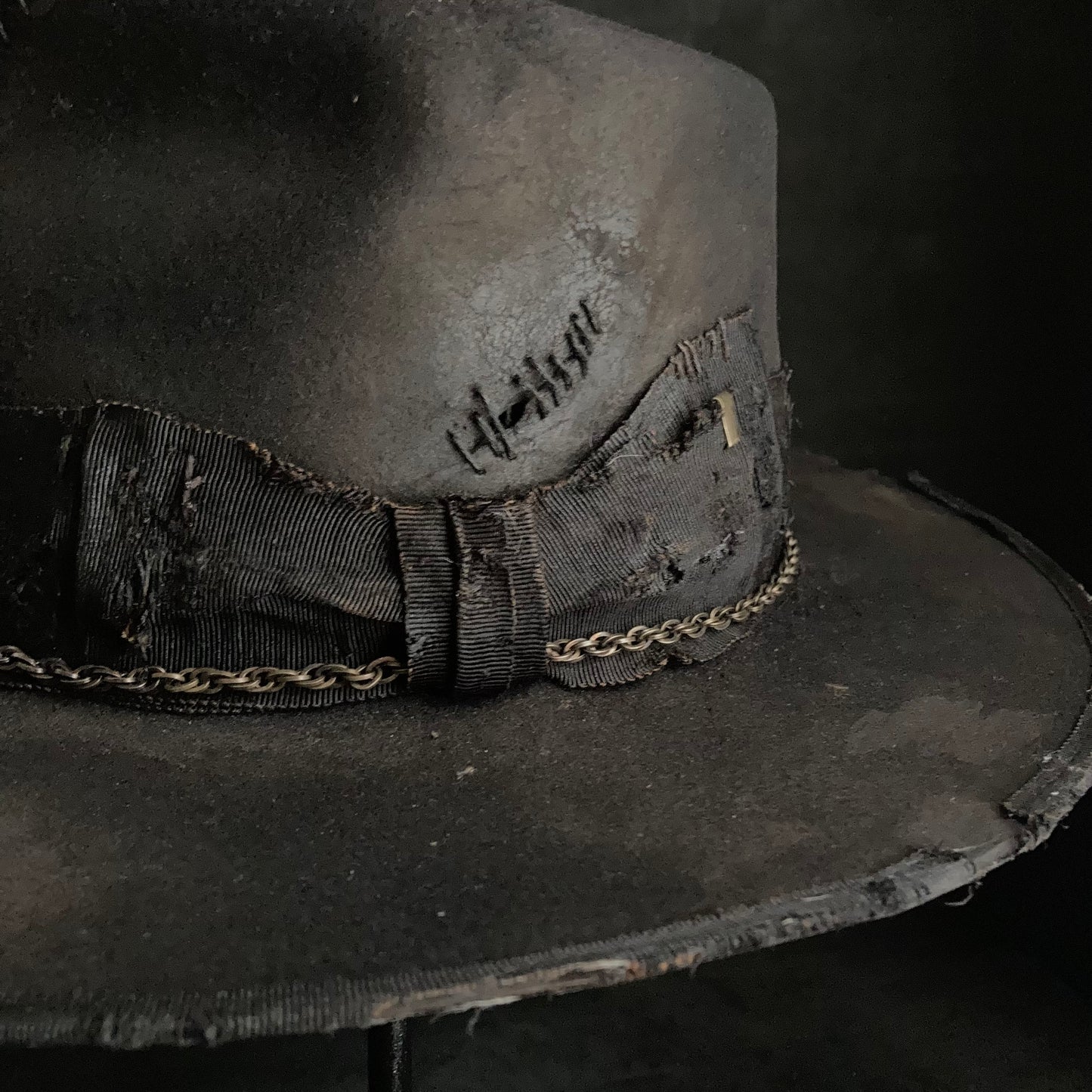 Damaged black rabbit fedora