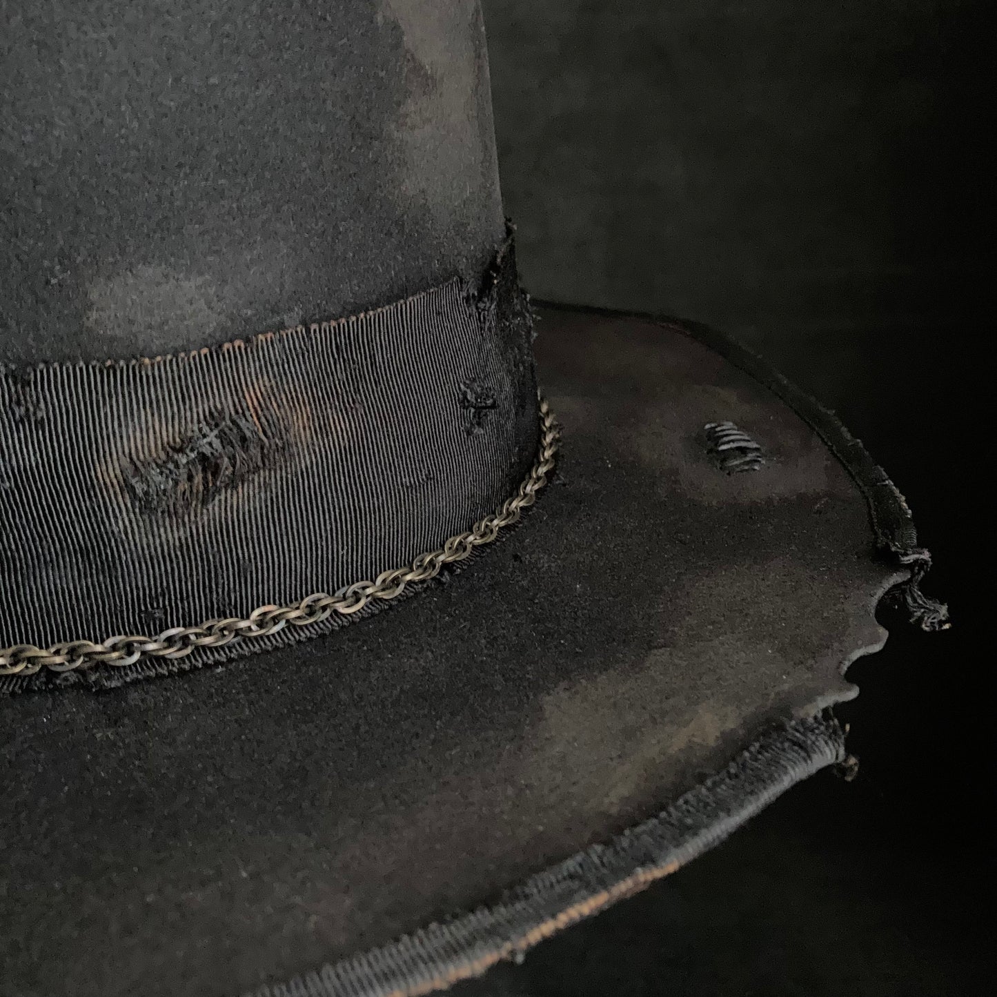 Damaged black rabbit fedora