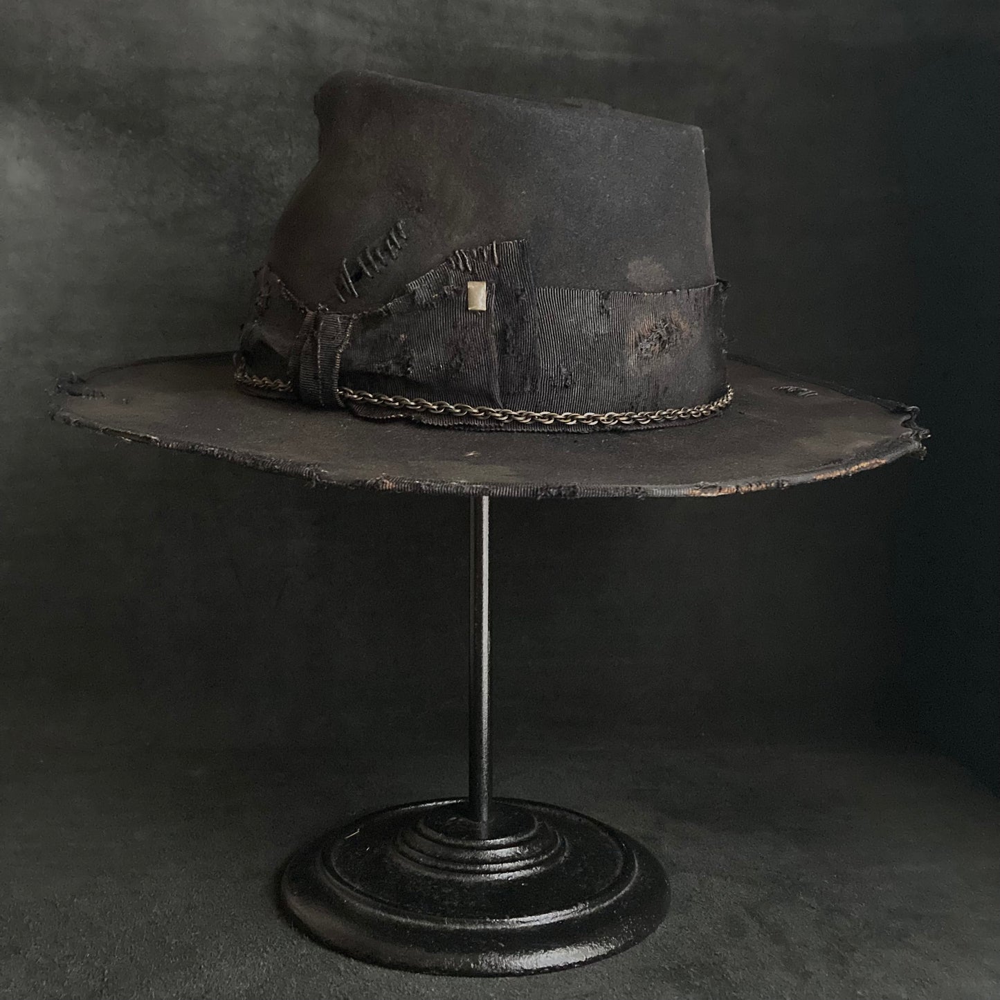 Damaged black rabbit fedora