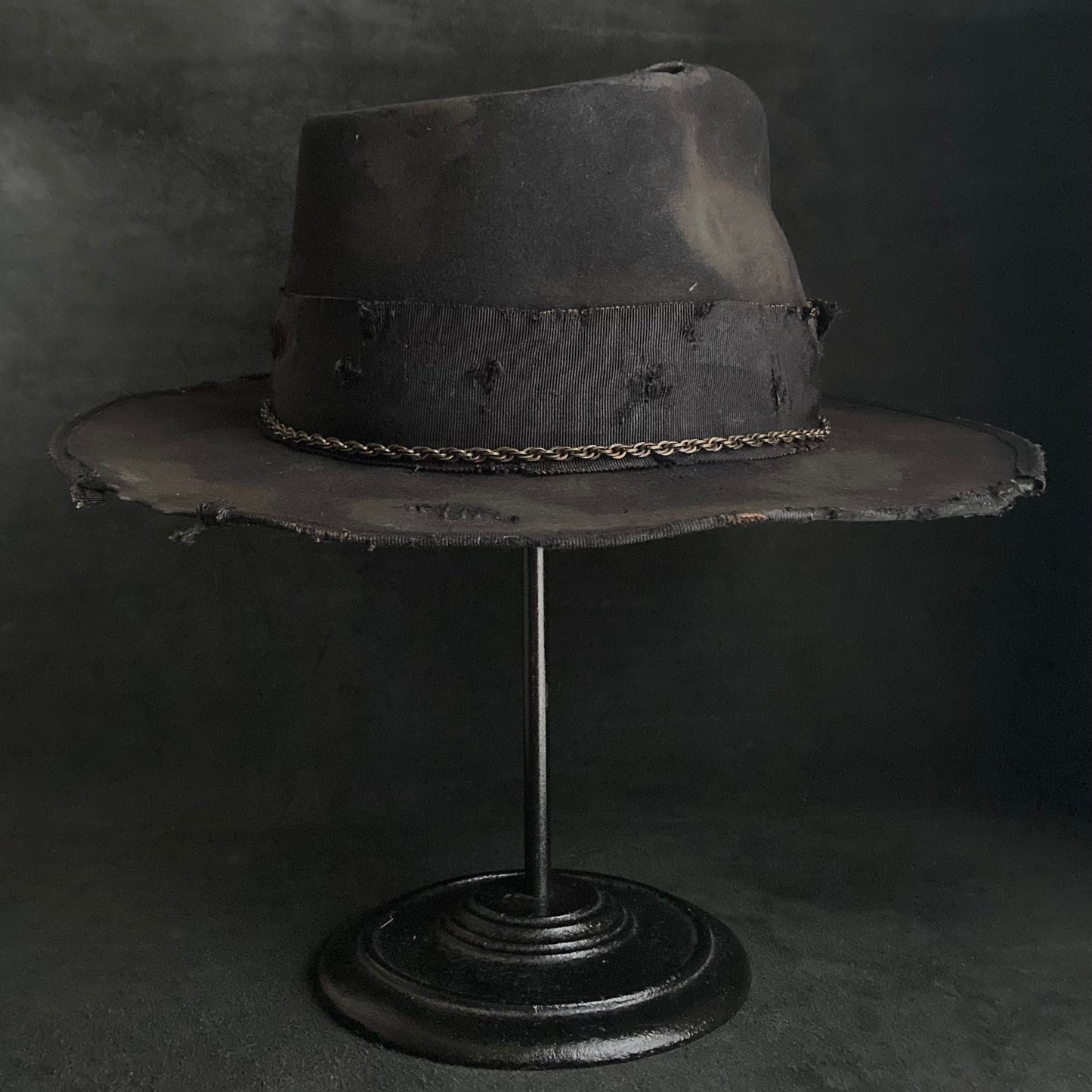 Damaged black rabbit fedora