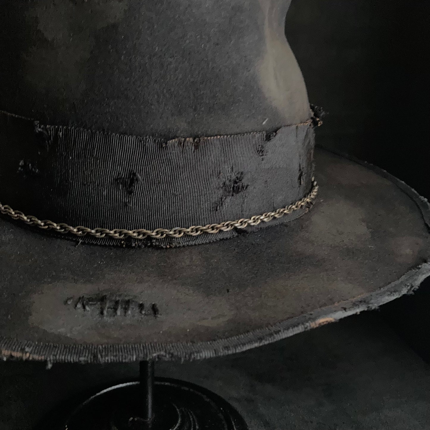Damaged black rabbit fedora